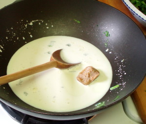 Milk and roux cube to make sauce - www.inhabitedkitchen.com