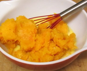 Beating cooked squash into eggs - www.inhabitedkitchen.com