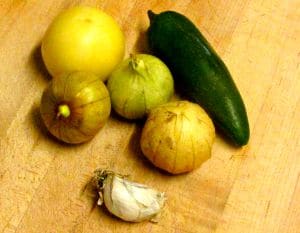 Broil, then puree tomatillos and aromatics for a simple salsa verde - www.inhabitedkitchen.com