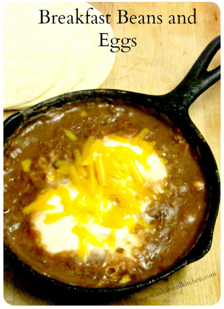 A quick, easy, and nutritious breakfast of beans and eggs, with perhaps a sprinkle of cheese, served over corn tortillas.