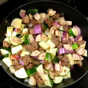 Sausage, zucchini and eggplant in a pan