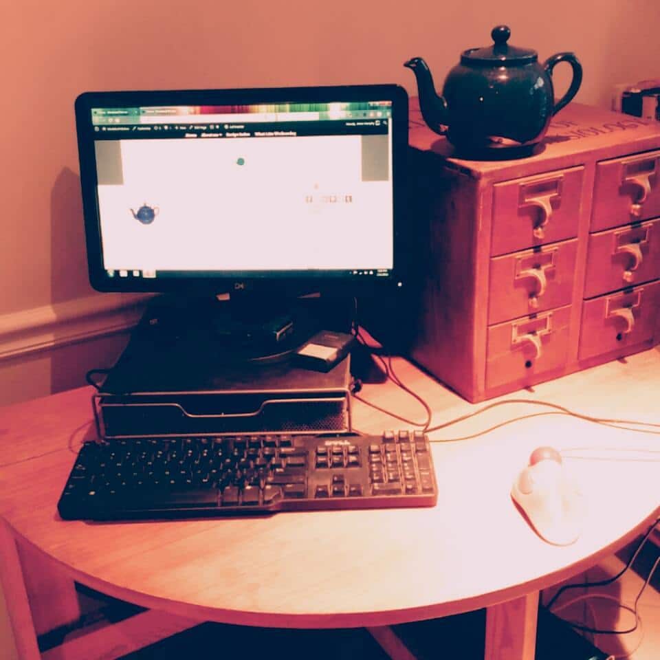 My desk - actually a drop leaf table - in the corner of the kitchen.