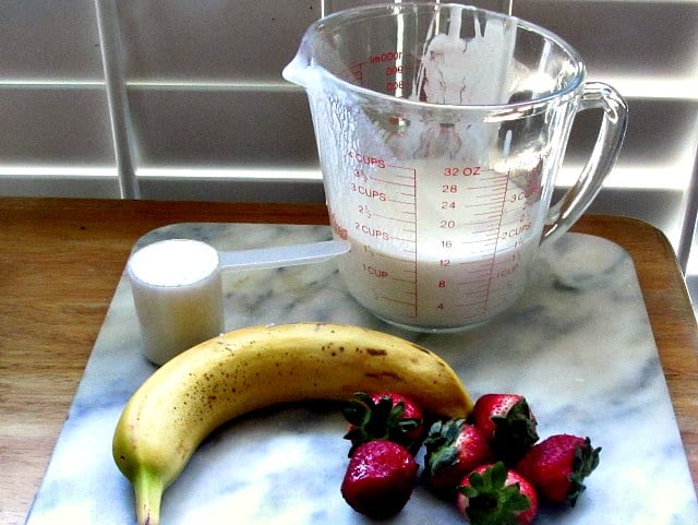 Assembled ingredients for Strawberry Kefir Protein Shake.